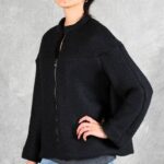LYNN minimalist jacket sewing pattern: angled view of a loose black jacket with long sleeves and a clean front zip.