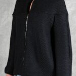 LYNN black jacket sewing pattern: close three-quarter view showing the textured fabric, front zipper and relaxed sleeve.