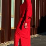 ALICIA elegant long dress sewing pattern presentation emphasizing the flowing shoulder overlay, slim skirt and side slit of the asymmetric design.