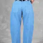 Close-up of the back of BALLOON barrel-leg jeans sewing pattern, showing the waistband and large back patch pockets.
