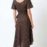 SIENNA wrap dress sewing pattern: back view of the brown polka-dot dress, showing its short sleeves and longer rear skirt.