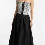 ECLIPSE strapless bustier sewing pattern: white floral lace bodice with black front hooks, worn with a black midi skirt.