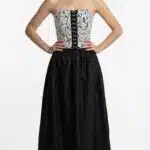 ECLIPSE fitted bustier sewing pattern, front view of the black-and-white lace top with the model’s hands on her hips.