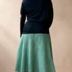Model wearing a skirt made from the CHANTELLE sewing pattern: the panel layout can be adapted to plain or contrasting fabrics. A creative take on a structured skirt design.