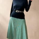 Model wearing a skirt made from the CHANTELLE sewing pattern: the patchwork lines continue into a softly spreading midi hem. Suitable for a distinctive handmade everyday outfit.